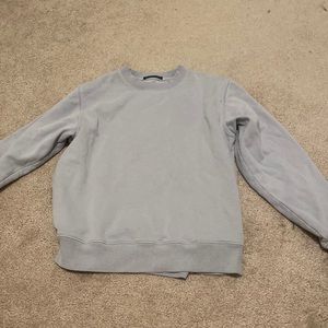 Brandy Melville, light blue sweatshirt.